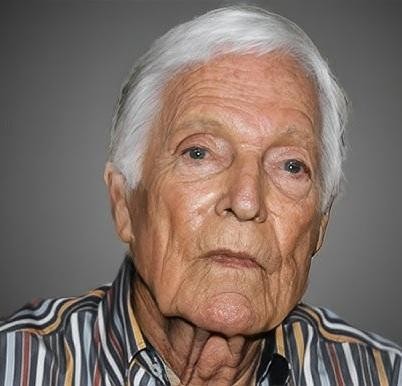 Richard Chamberlain w późniejszych latach życia, malujący obraz, z hawajskim krajobrazem w tle, ukazujący jego pasję do sztuki i spokojne życie na emeryturze.